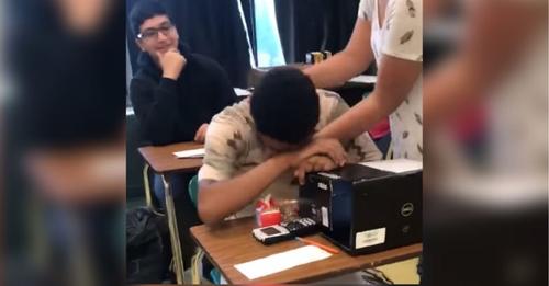 Struggling boy opens backpack teen girl put on his desk and quickly drops head down