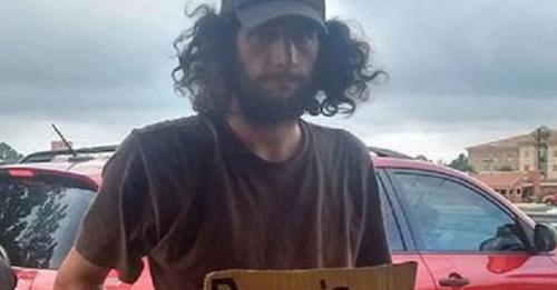 Woman Started To Drive Past Homeless Man, Then Notices His Carboard Sign And She Slams On The Brakes