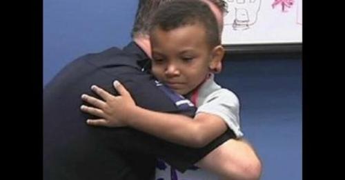 5-yr-old steps into police station with a sign – Officers See two words On It